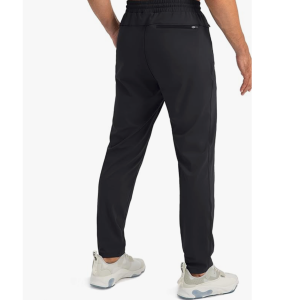 Rear view of G Gradual men's athletic pants in black highlighting the secure zippered back pocket and modern tapered fit. 