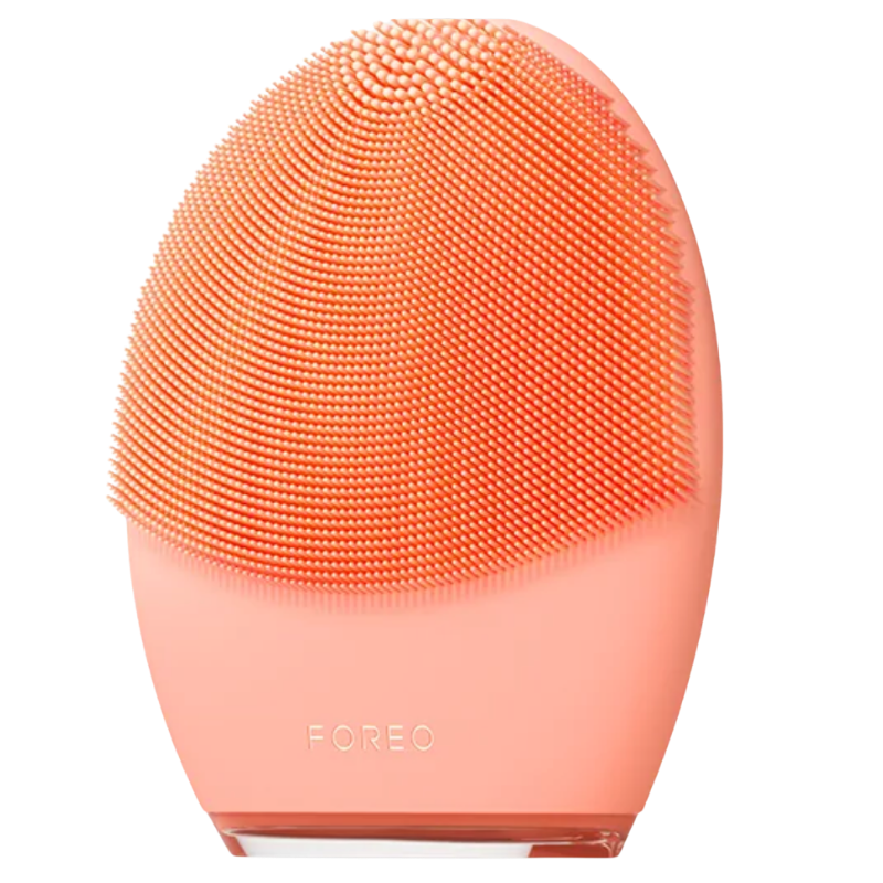 Close-up of the front side of the FOREO LUNA 4 smart facial brush in Peach Perfect, showcasing the dense, soft silicone cleansing bristles designed for sensitive skin.