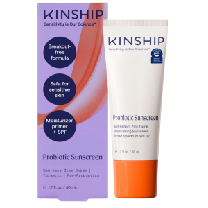 Product graphic displaying the Kinship Self Reflect SPF 32 squeeze tube standing next to its lavender and orange cardboard outer box against a white background.