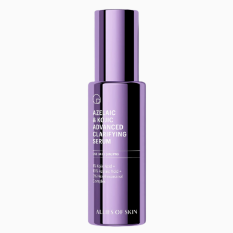 A metallic purple bottle of Allies of Skin Azelaic & Kojic Advanced Clarifying Serum on a clean white background. The front label features minimalist white typography detailing the specialized hyperpigmentation and redness-soothing ingredients.