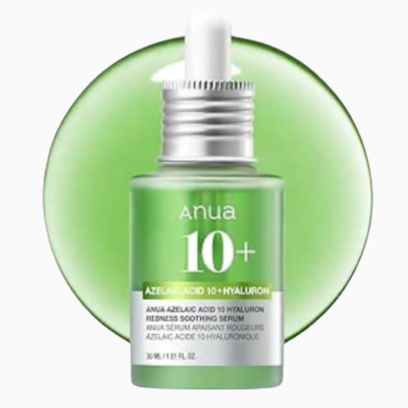 A frosted green glass dropper bottle of Anua Azelaic Acid 10 plus Hyaluron Redness Soothing Serum. The bottle sits against a smooth, matching translucent green circular backdrop showing white product text.