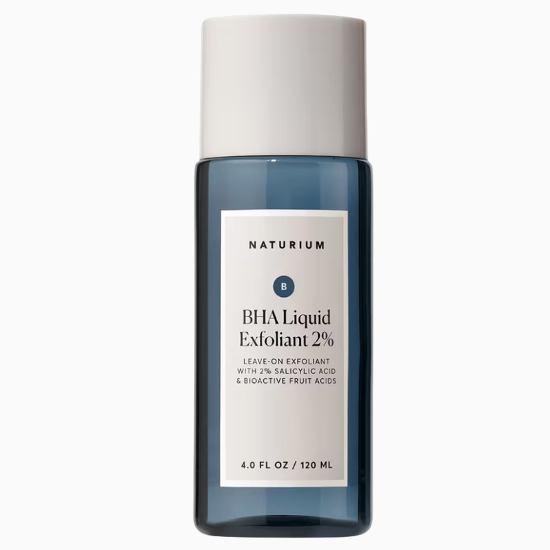 Naturium BHA Liquid Exfoliant 2% in a 120 ml dark translucent blue bottle with a white cap, isolated against a white background. The front label states it is a leave-on exfoliant formulated with 2% salicylic acid and bioactive fruit acids.