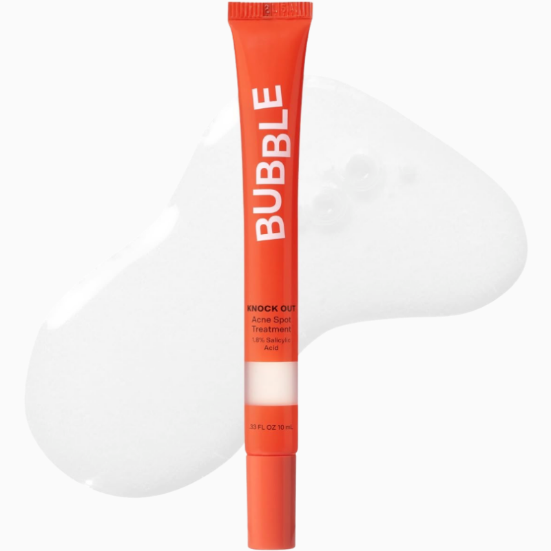 Bubble Skincare Knock Out Acne Spot Treatment in a slender 10 ml bright red squeeze tube with a clear gel smear background texture. The label highlights the product formula as a 1.8% Salicylic Acid treatment designed for targeted blemish clearing.